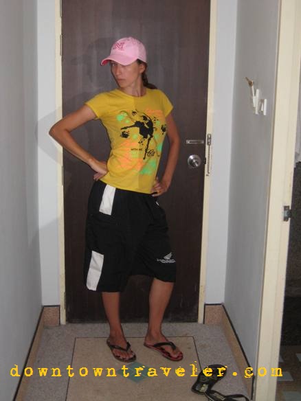 A fashionable outfit created from $1 hat, shirt and shorts in Thailand.