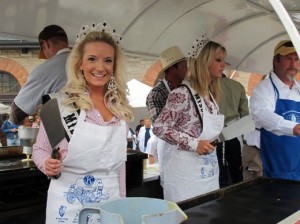 Rodeo queens flip pancakes at Wyoming's Cheyenne Frontier Days festival