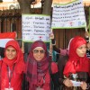 Young women in front of the Egyptian Museum in Cairo rally to promote tourism.